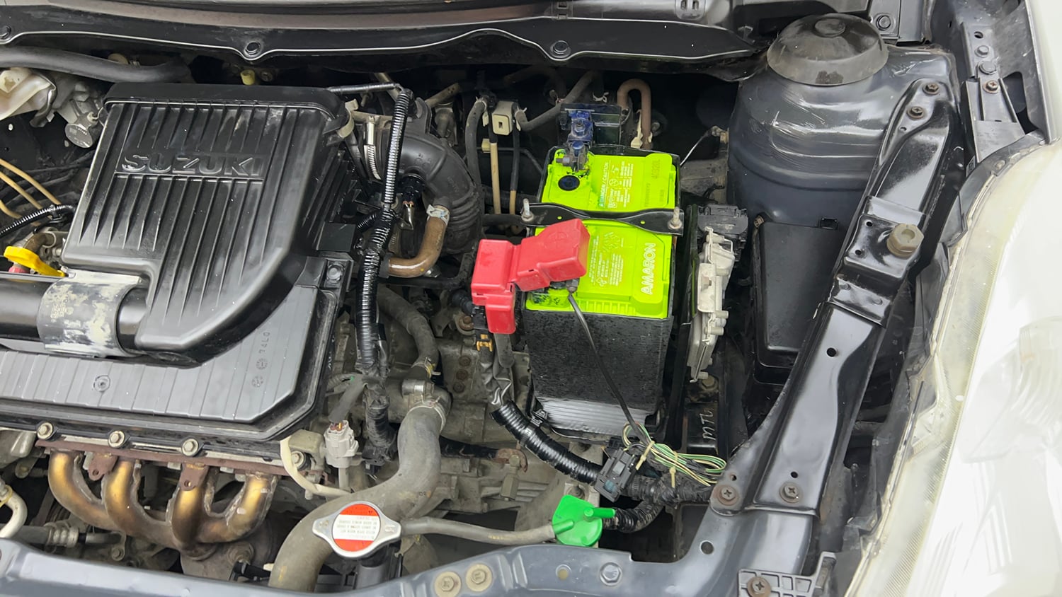 Used 2017 Maruti Suzuki Swift Lxi (O) Petrol Manual engine ENGINE LEFT SIDE VIEW