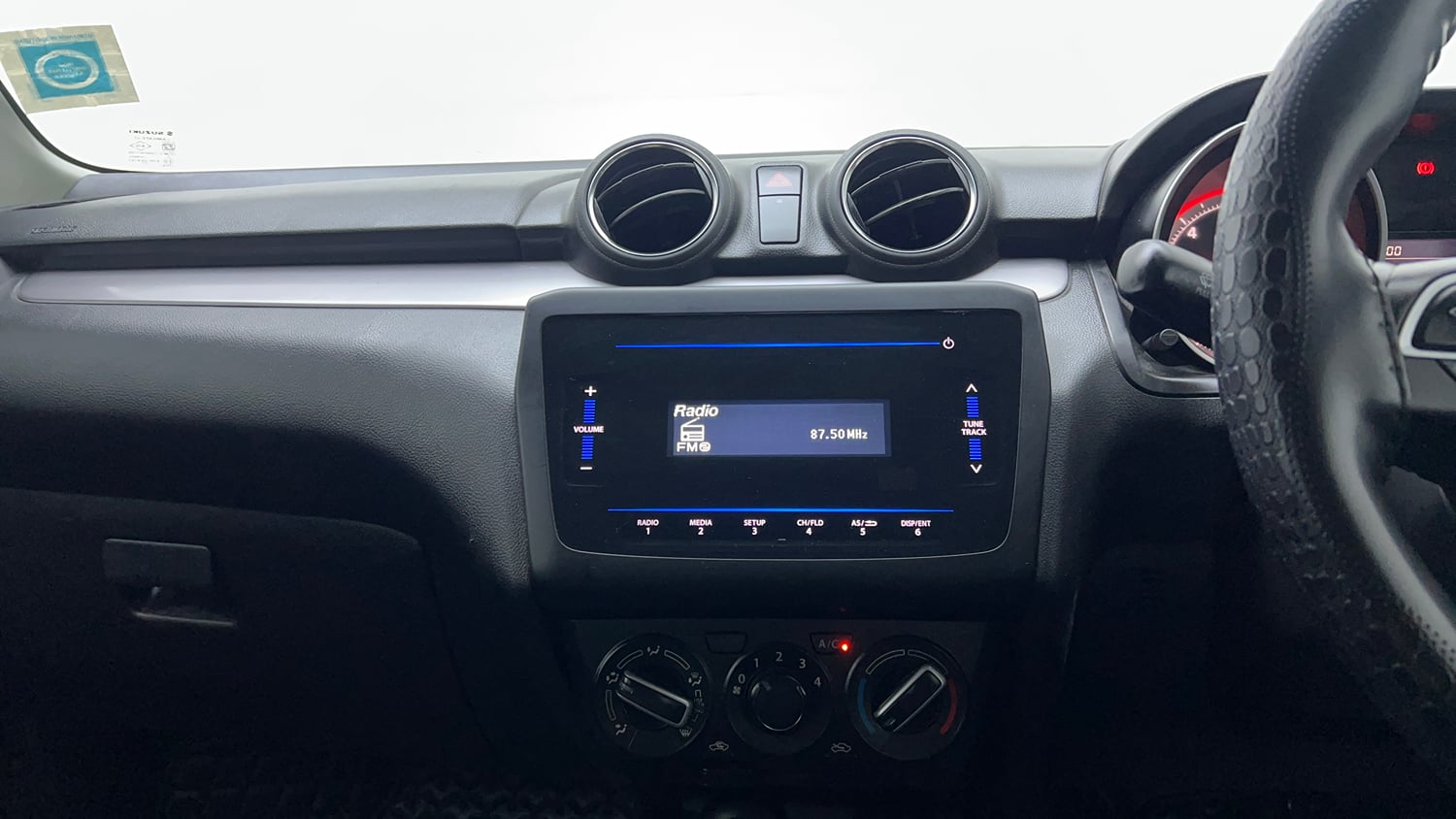 Used 2023 Maruti Suzuki Swift VXi Petrol Manual top_features Integrated (in-dash) music system