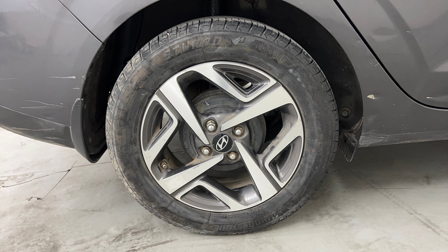 Used 2023 Hyundai Aura SX 1.2 CNG Cng Manual tyres RIGHT REAR TYRE RIM VIEW