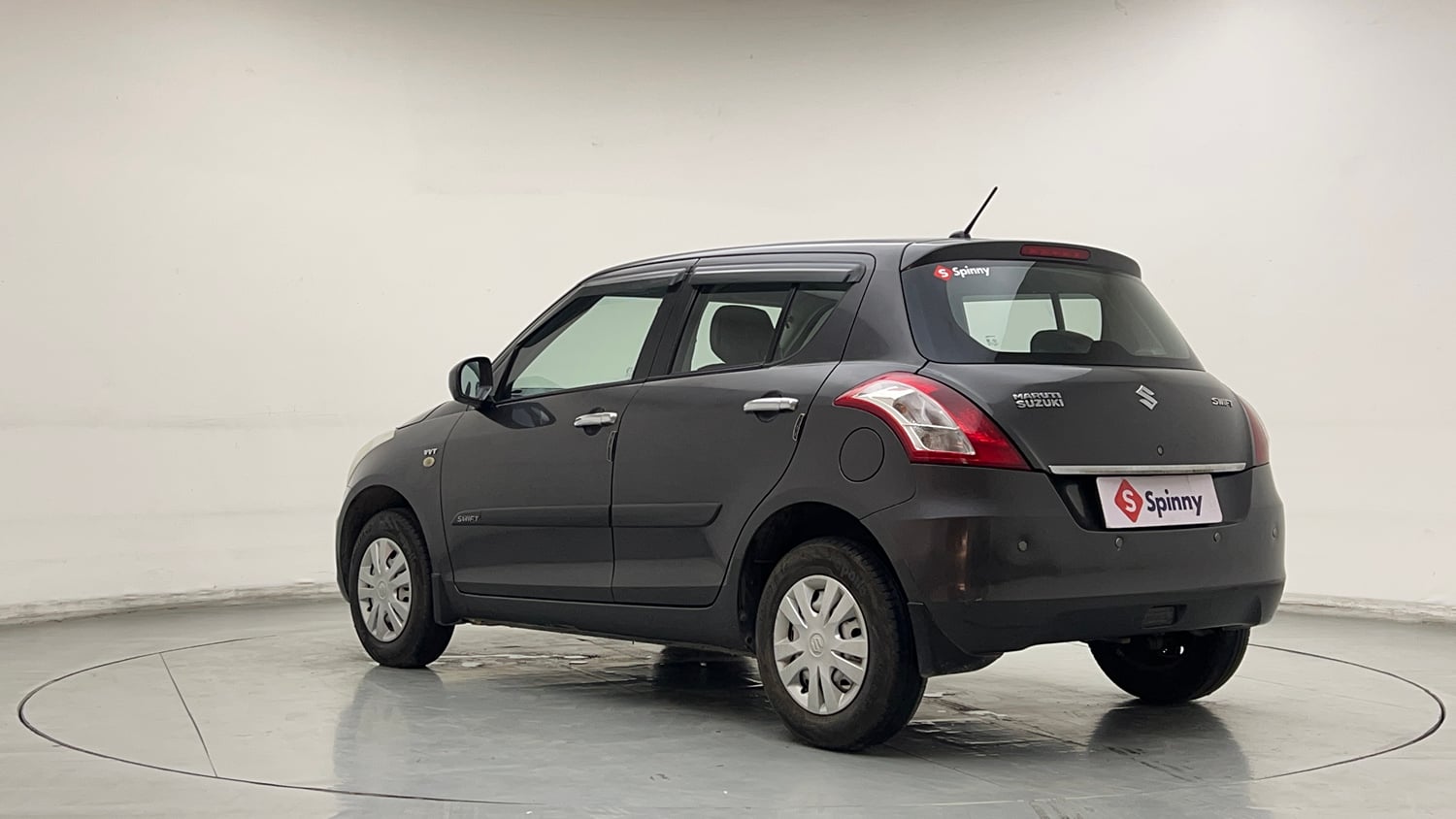 Used 2017 Maruti Suzuki Swift Lxi (O) Petrol Manual exterior LEFT REAR CORNER VIEW