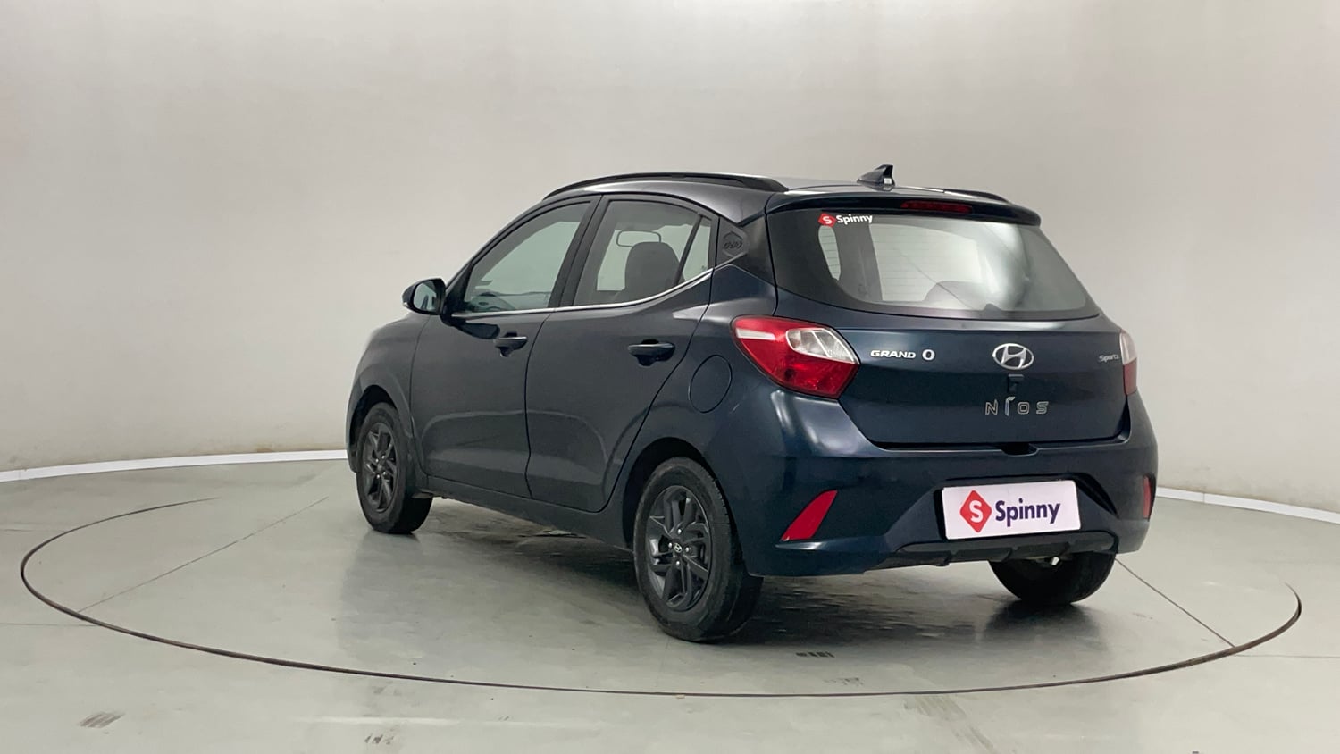 Used 2021 Hyundai Grand i10 Nios Sportz Petrol+cng(outside fitted) Cng Manual exterior LEFT REAR CORNER VIEW