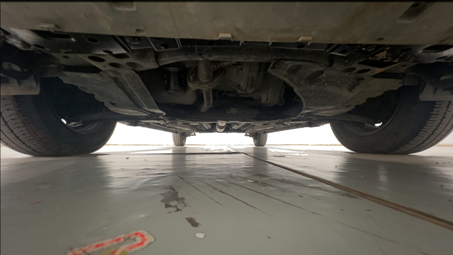 Used 2017 Maruti Suzuki Swift Lxi (O) Petrol Manual extra FRONT LEFT UNDERBODY VIEW