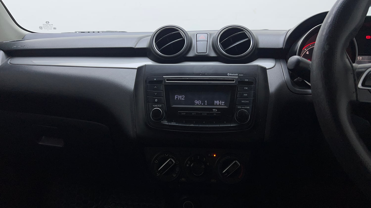 Used 2018 Maruti Suzuki Swift VXi Petrol Manual top_features Integrated (in-dash) music system