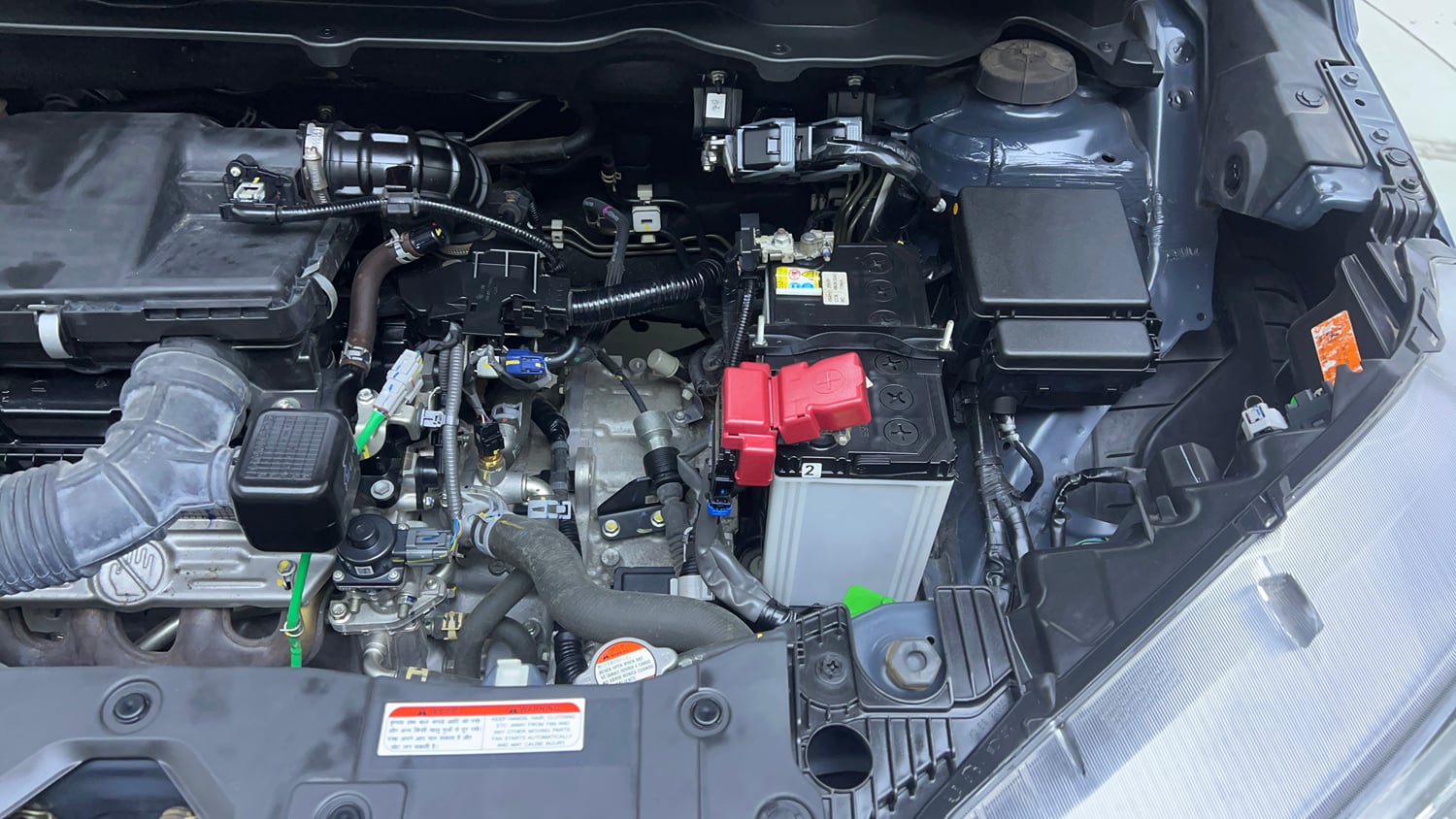 Used 2023 Maruti Suzuki XL6 Alpha AT Petrol Petrol Automatic engine ENGINE LEFT SIDE VIEW