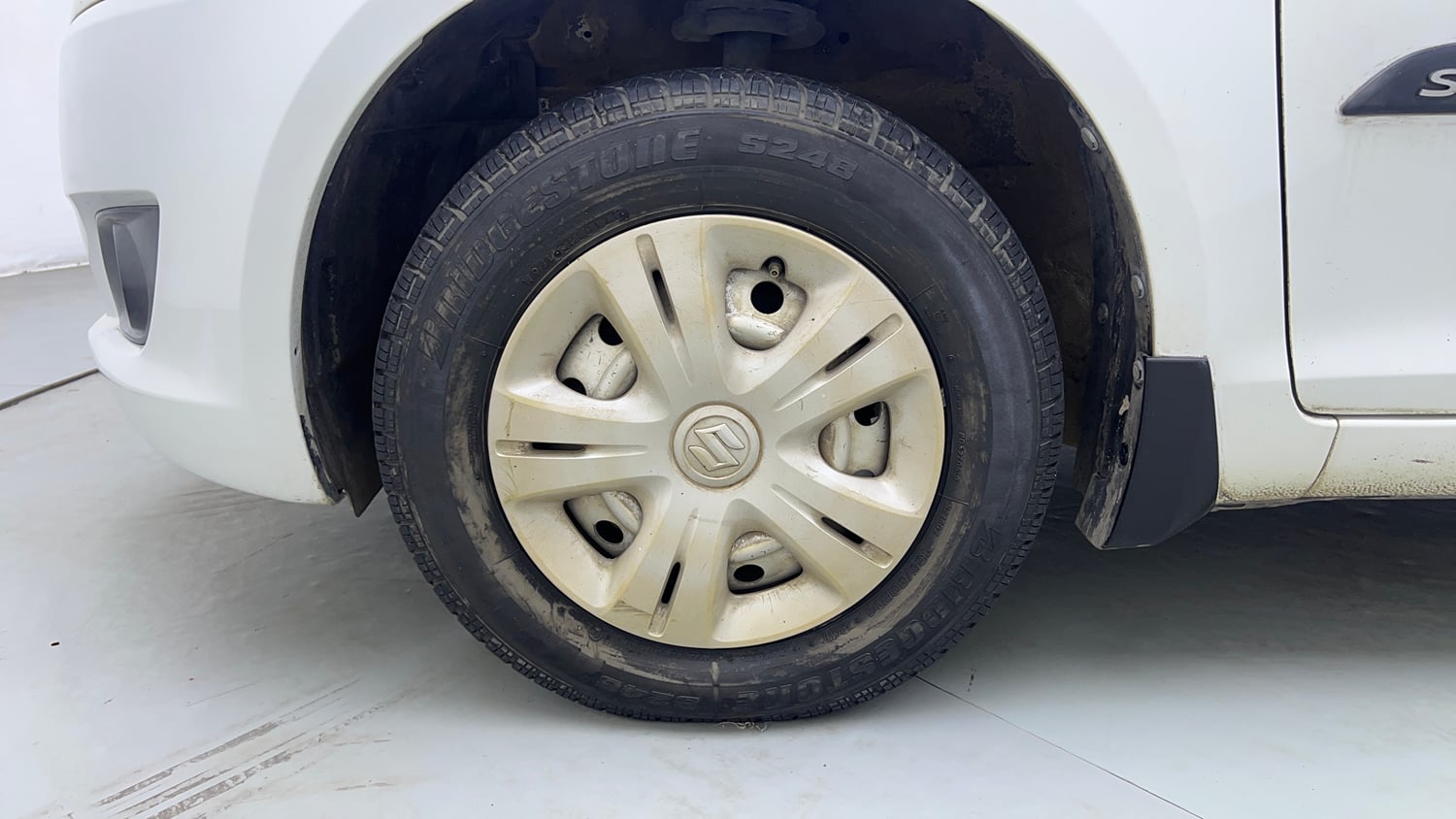 Used 2013 Maruti Suzuki Swift LXi Petrol Manual tyres LEFT FRONT TYRE RIM VIEW