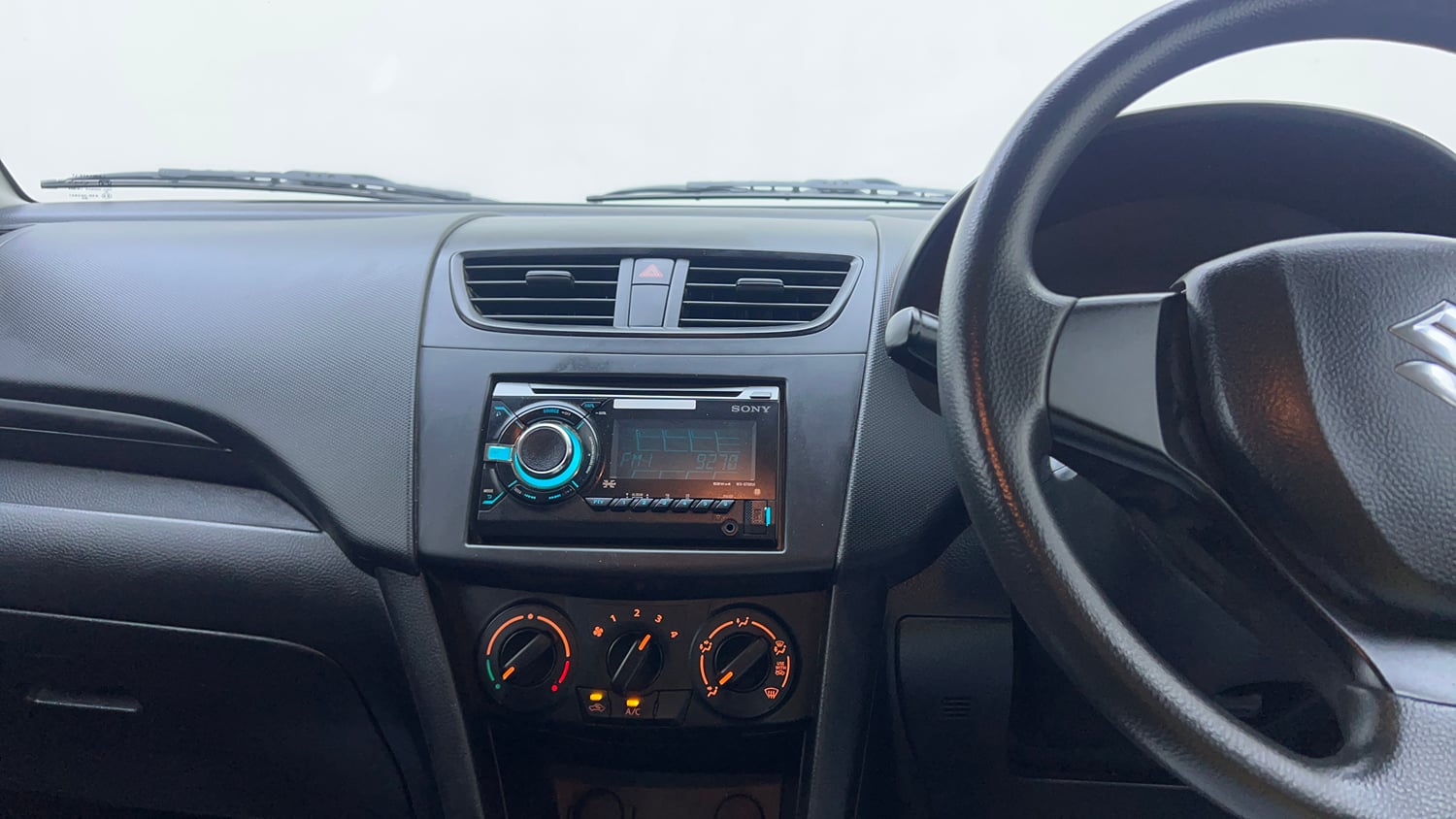 Used 2013 Maruti Suzuki Swift LXi Petrol Manual interior MUSIC SYSTEM & AC CONTROL VIEW