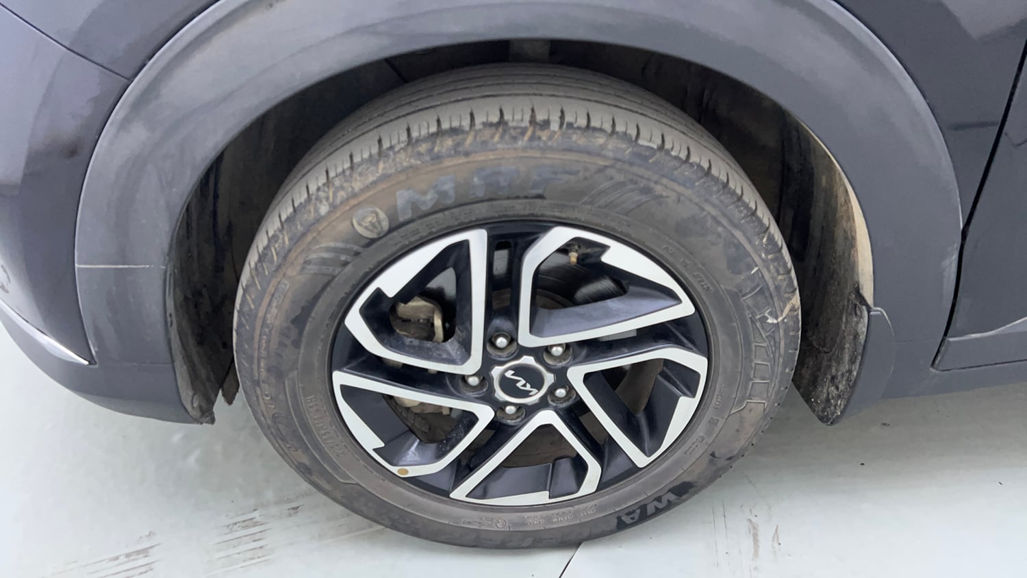 Used 2022 Kia Carens Prestige Plus 1.4 Petrol MT 7 STR Petrol Manual tyres LEFT FRONT TYRE RIM VIEW
