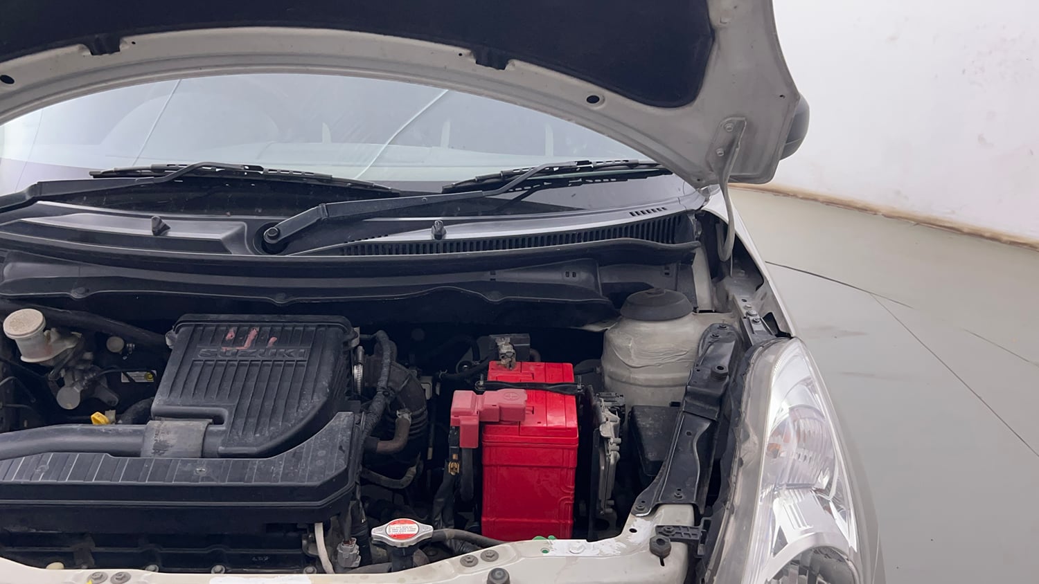 Used 2017 Maruti Suzuki Swift Lxi (O) Petrol Manual engine ENGINE LEFT SIDE HINGE & APRON VIEW