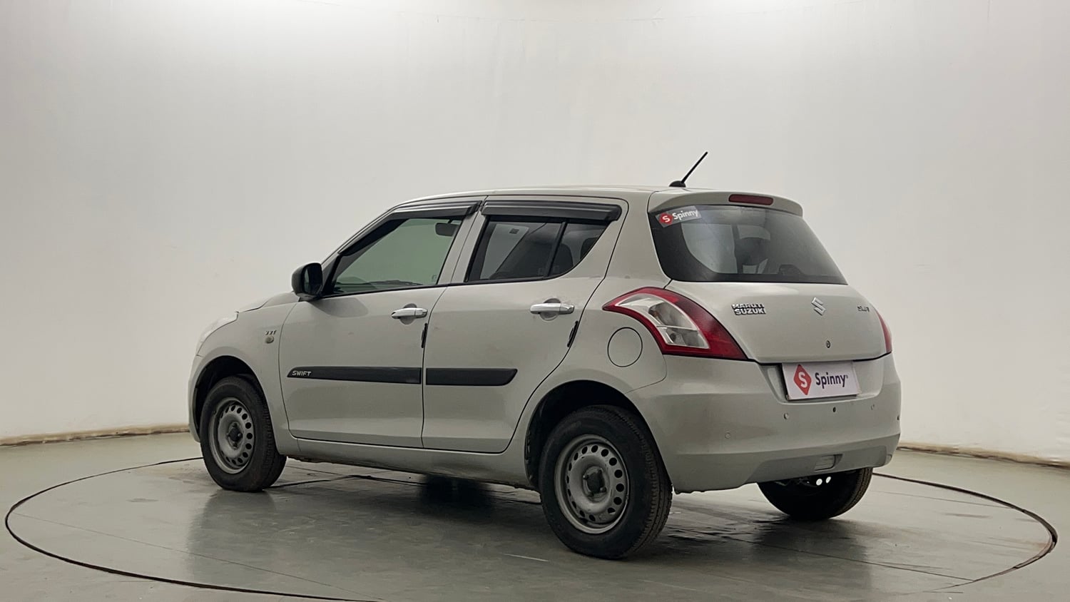 Used 2017 Maruti Suzuki Swift Lxi (O) Petrol Manual exterior LEFT REAR CORNER VIEW