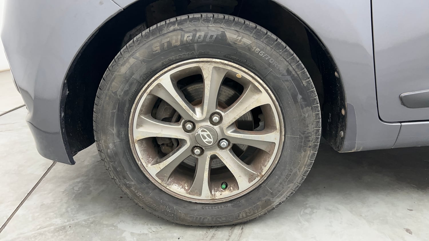 Used 2014 Hyundai Grand i10 Asta 1.2 Kappa VTVT (O) Petrol Manual tyres LEFT FRONT TYRE RIM VIEW