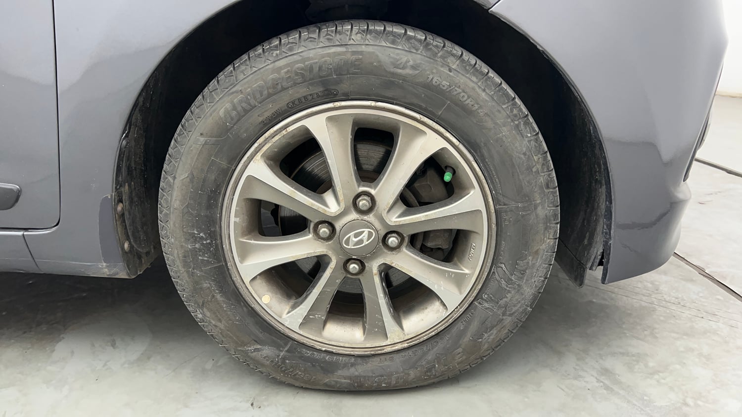 Used 2014 Hyundai Grand i10 Asta 1.2 Kappa VTVT (O) Petrol Manual tyres RIGHT FRONT TYRE RIM VIEW