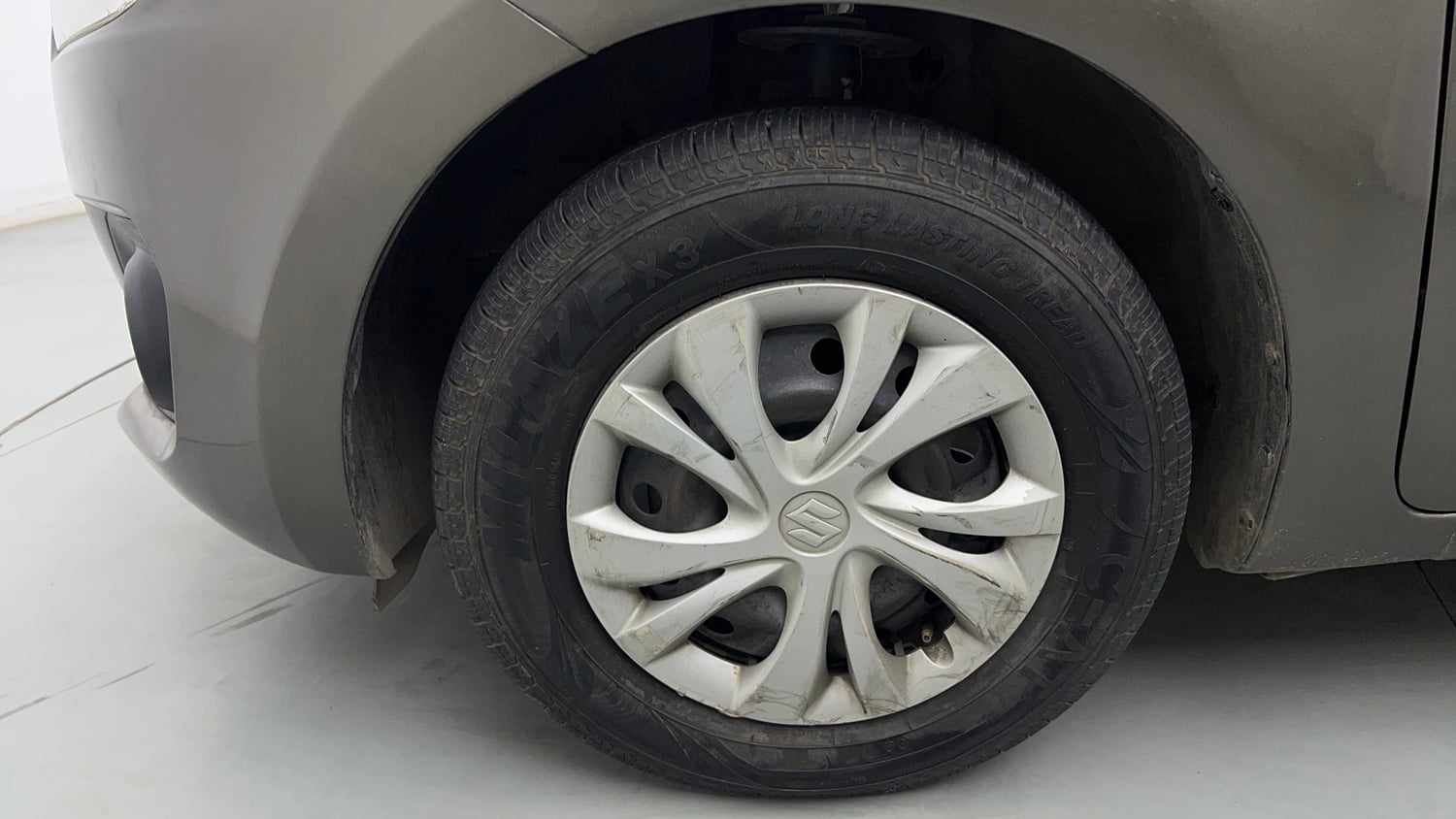 Used 2018 Maruti Suzuki Swift VXi Petrol Manual tyres LEFT FRONT TYRE RIM VIEW