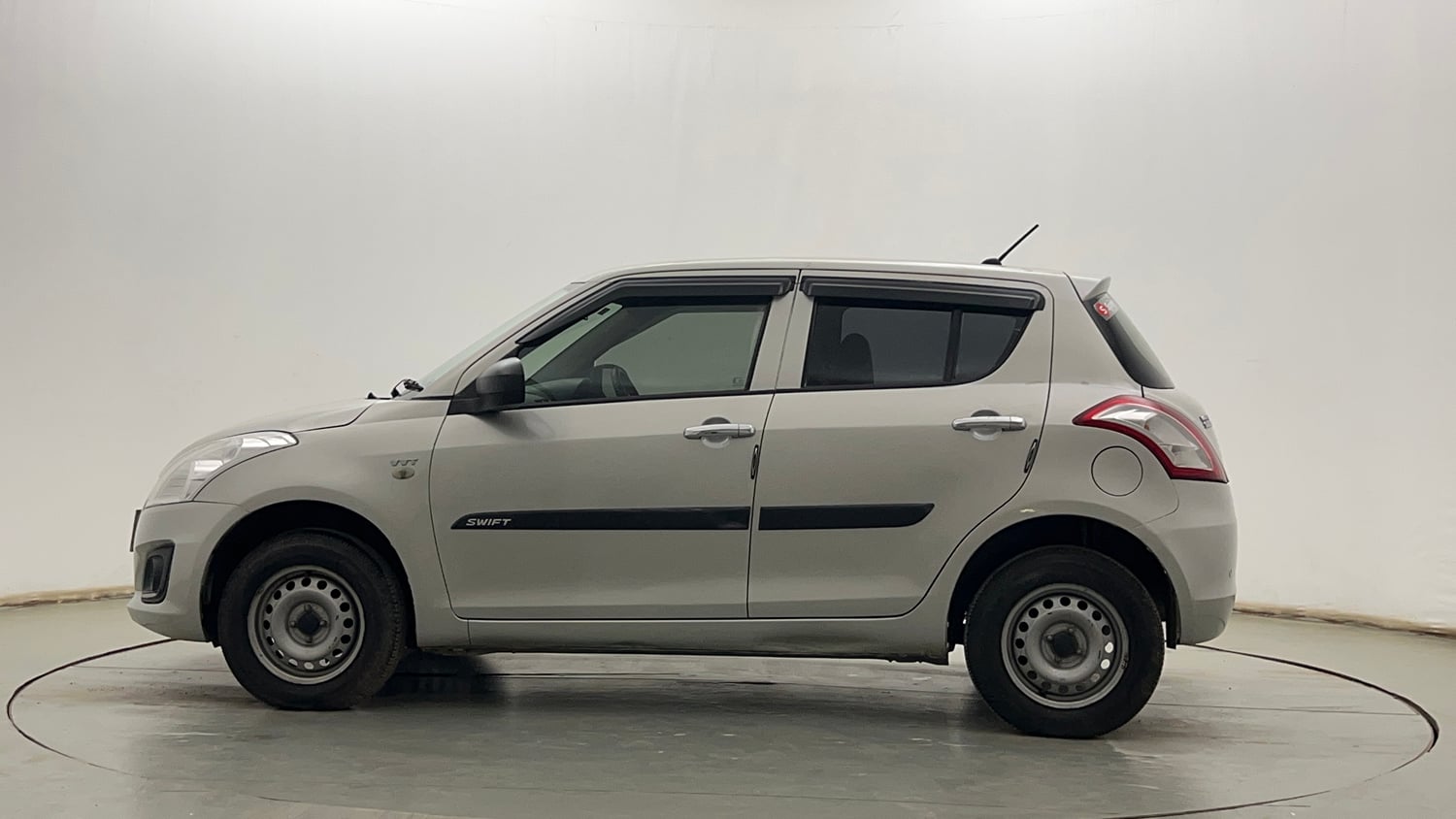 Used 2017 Maruti Suzuki Swift Lxi (O) Petrol Manual exterior LEFT SIDE VIEW