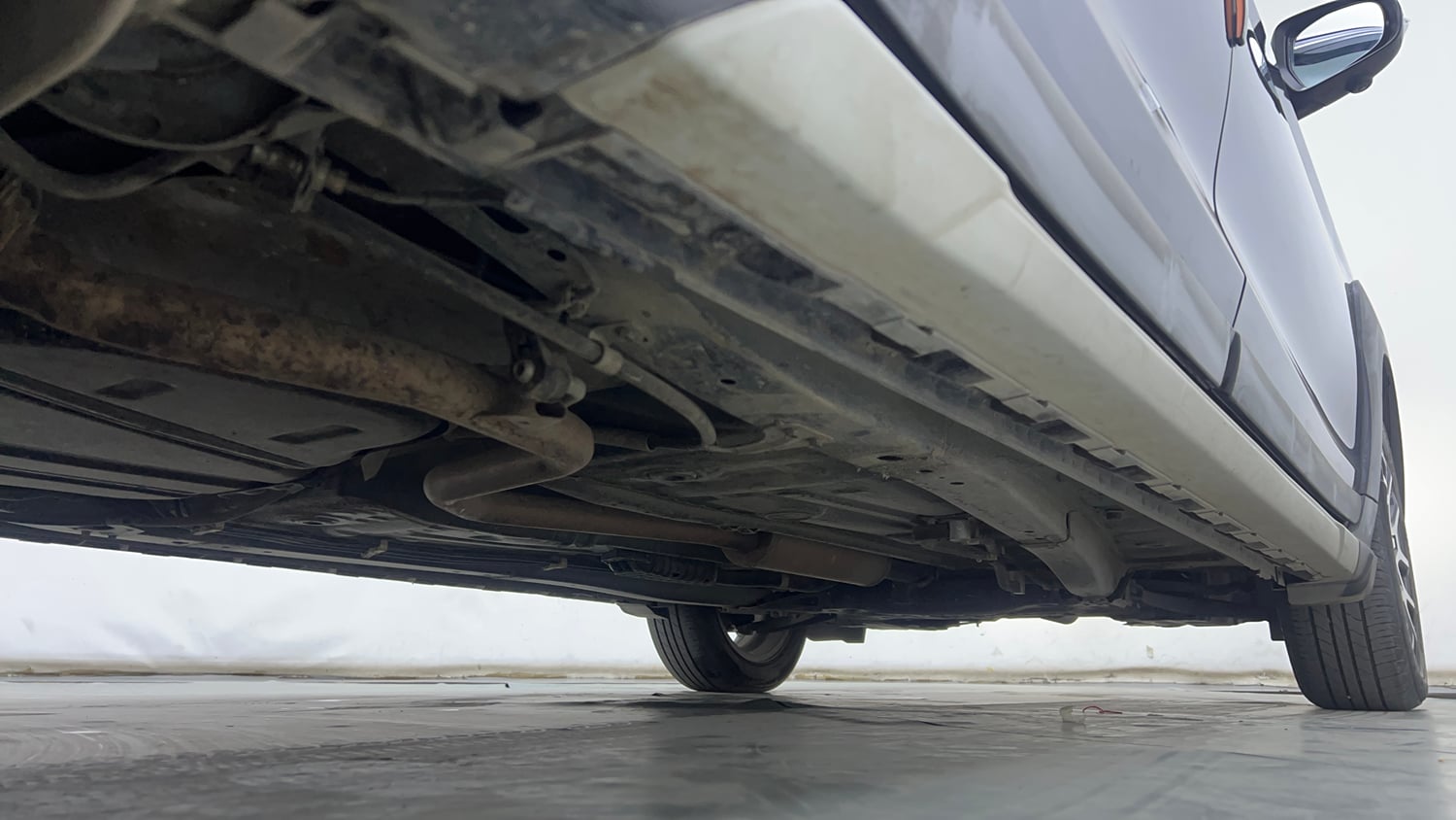 Used 2023 Maruti Suzuki XL6 Alpha AT Petrol Petrol Automatic extra REAR RIGHT UNDERBODY VIEW
