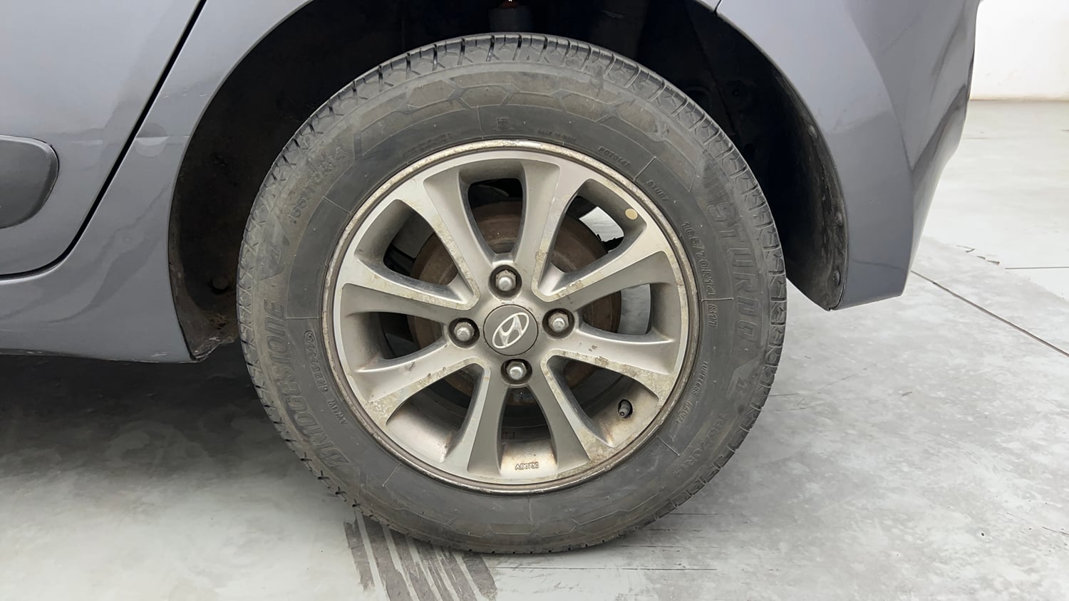 Used 2014 Hyundai Grand i10 Asta 1.2 Kappa VTVT (O) Petrol Manual tyres LEFT REAR TYRE RIM VIEW