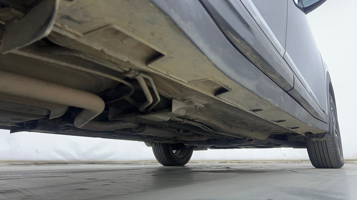 Used 2022 Kia Carens Prestige Plus 1.4 Petrol MT 7 STR Petrol Manual extra REAR RIGHT UNDERBODY VIEW