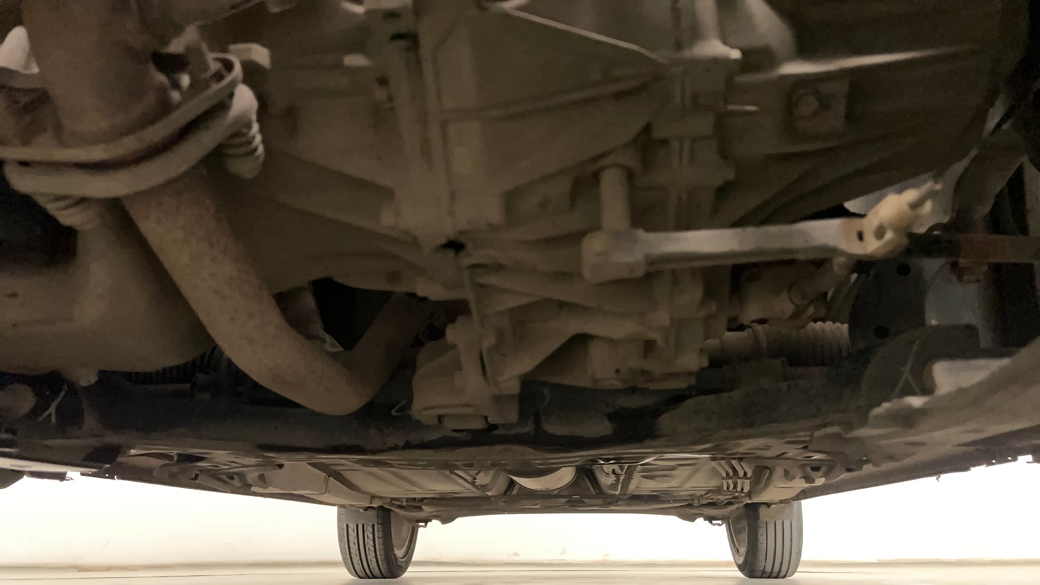 Used 2020 Maruti Suzuki Baleno Zeta Petrol Manual extra FRONT LEFT UNDERBODY VIEW