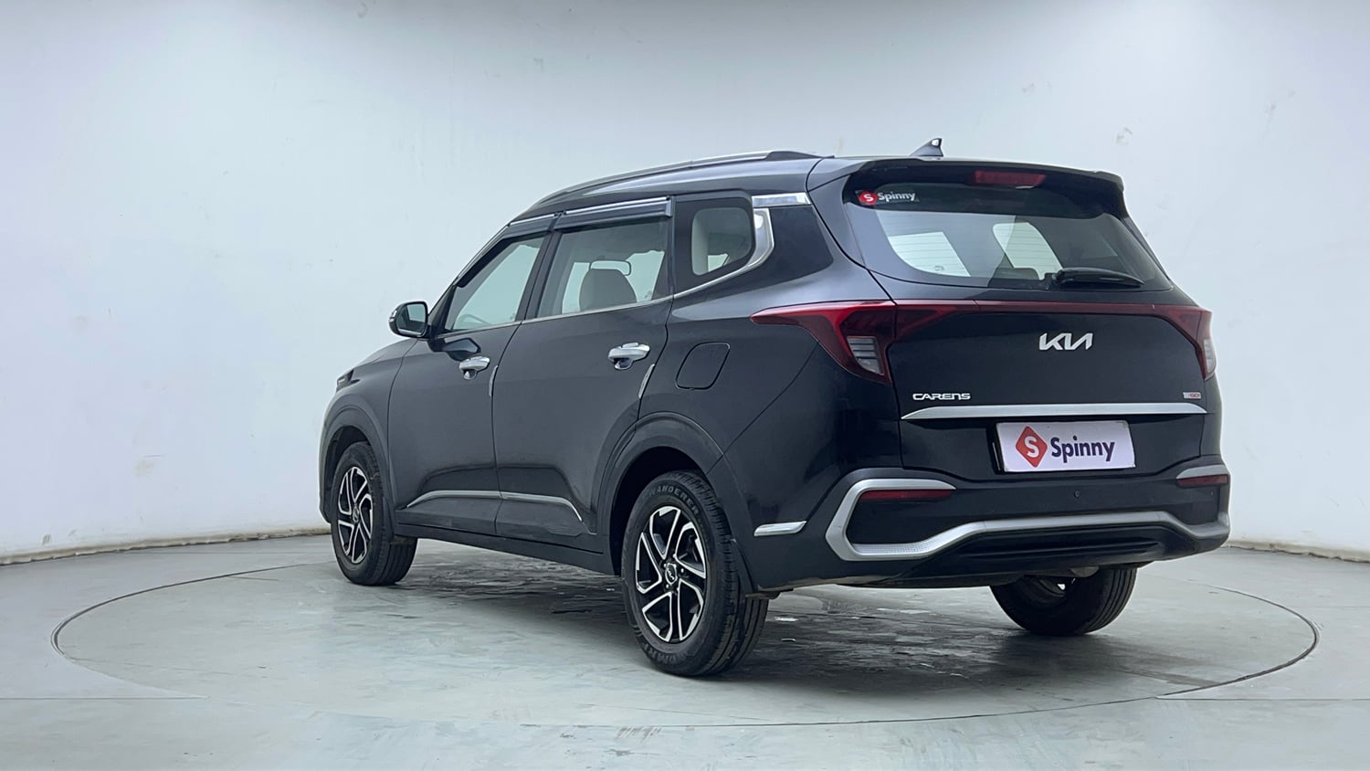 Used 2022 Kia Carens Prestige Plus 1.4 Petrol MT 7 STR Petrol Manual exterior LEFT REAR CORNER VIEW