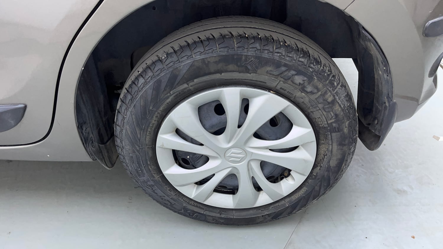 Used 2022 Maruti Suzuki Swift VXi Petrol Manual tyres LEFT REAR TYRE RIM VIEW