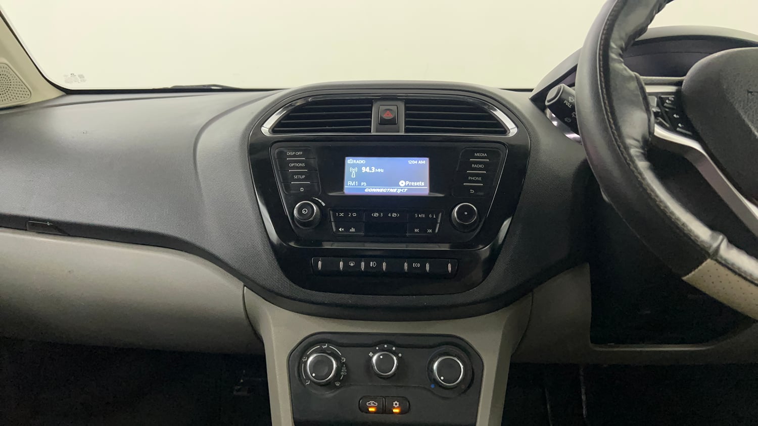 Used 2016 Tata Tiago Revotron XZ Petrol Manual interior MUSIC SYSTEM & AC CONTROL VIEW