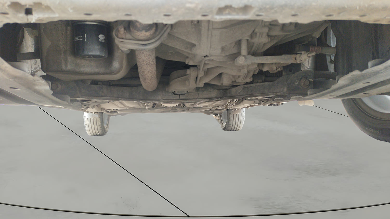 Used 2021 Maruti Suzuki Baleno Zeta Petrol Manual extra FRONT LEFT UNDERBODY VIEW