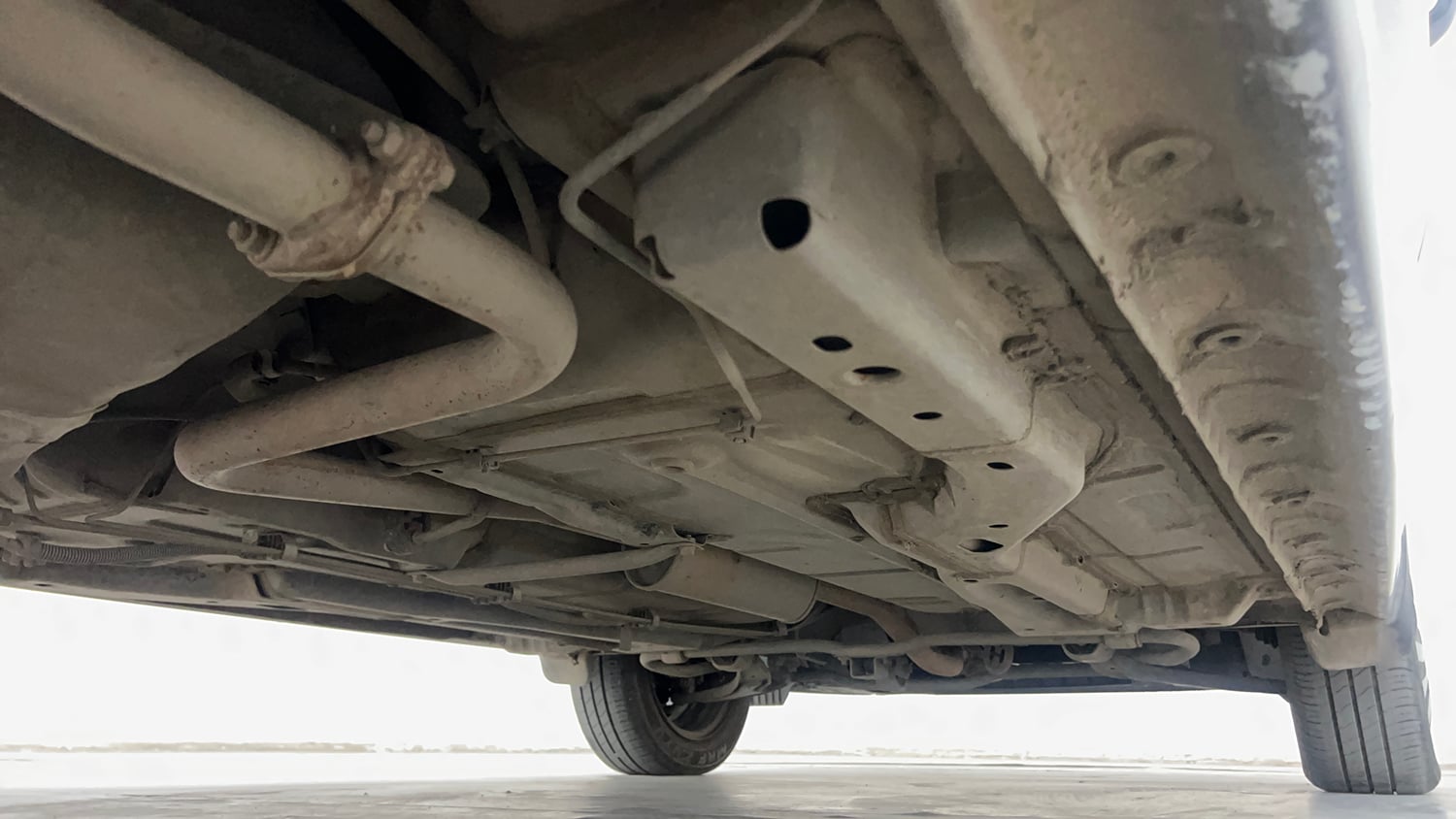 Used 2024 Tata Tigor XZA iCNG Cng Automatic extra REAR RIGHT UNDERBODY VIEW