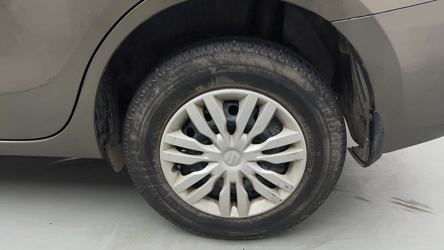 Used 2022 Maruti Suzuki Dzire VXi Petrol Manual tyres LEFT REAR TYRE RIM VIEW