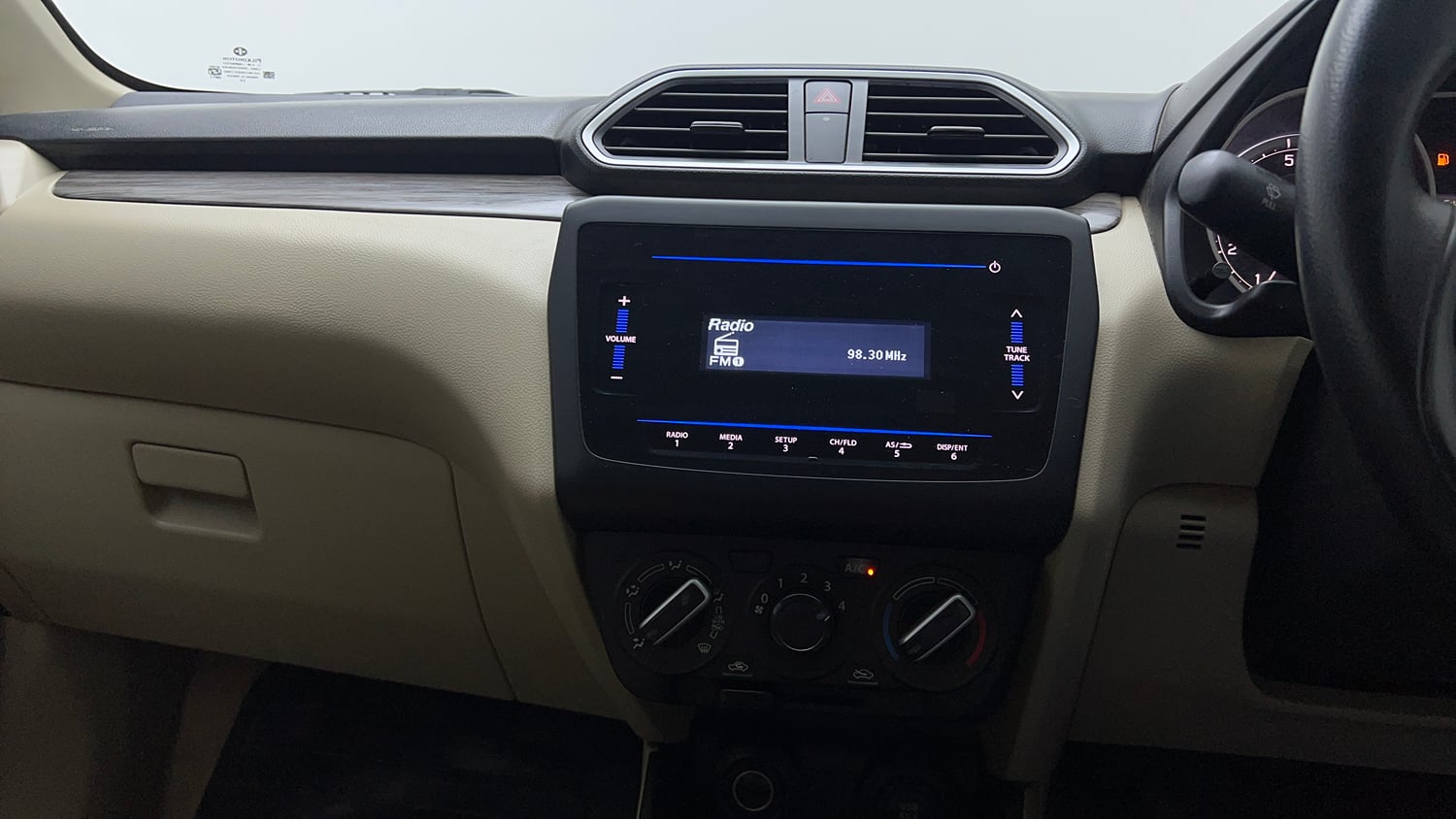 Used 2022 Maruti Suzuki Dzire VXi Petrol Manual top_features Integrated (in-dash) music system