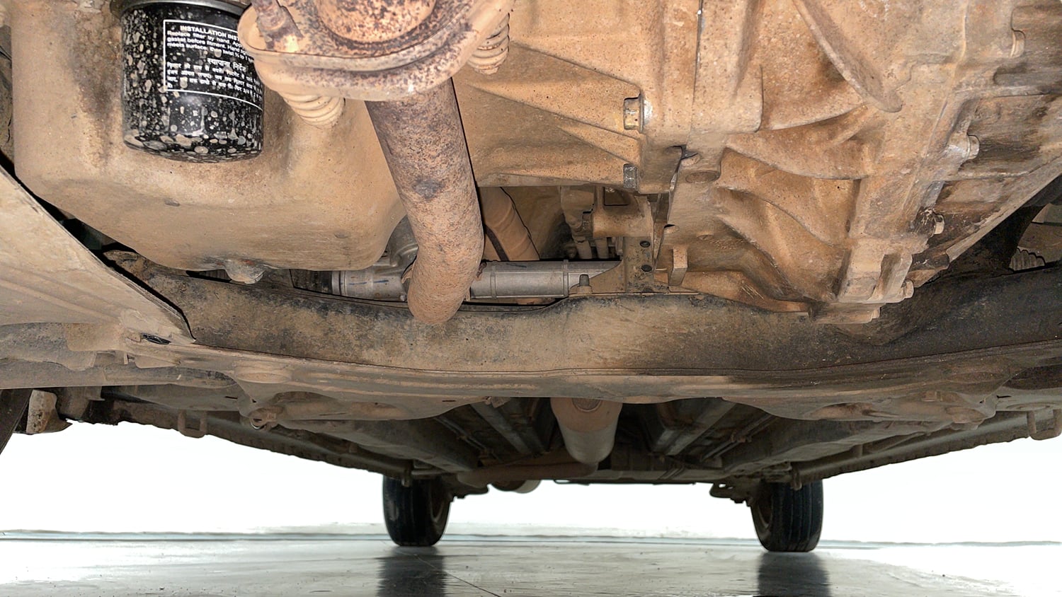 Used 2013 Maruti Suzuki Ertiga Vxi Petrol Manual extra FRONT LEFT UNDERBODY VIEW