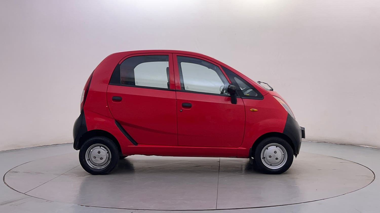 Used 2013 Tata Nano CX Petrol Manual exterior RIGHT SIDE VIEW