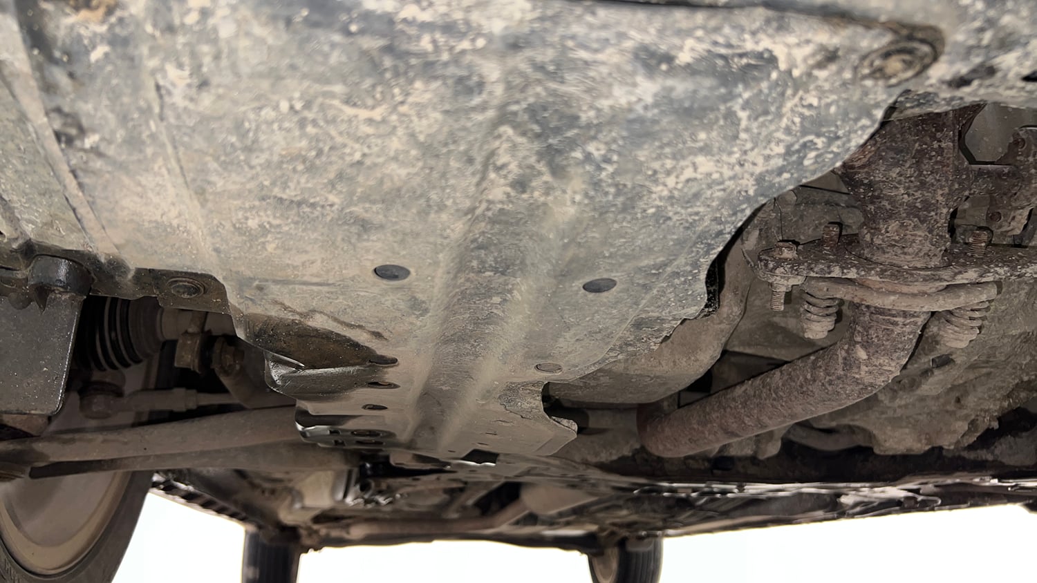 Used 2023 Maruti Suzuki XL6 Alpha MT Petrol Petrol Manual extra FRONT LEFT UNDERBODY VIEW