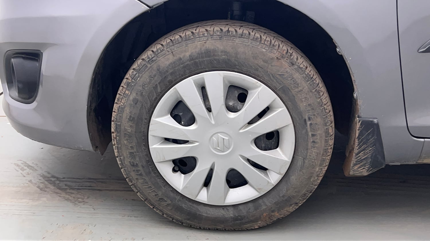 Used 2014 Maruti Suzuki Swift Dzire VXI Petrol Manual tyres LEFT FRONT TYRE RIM VIEW