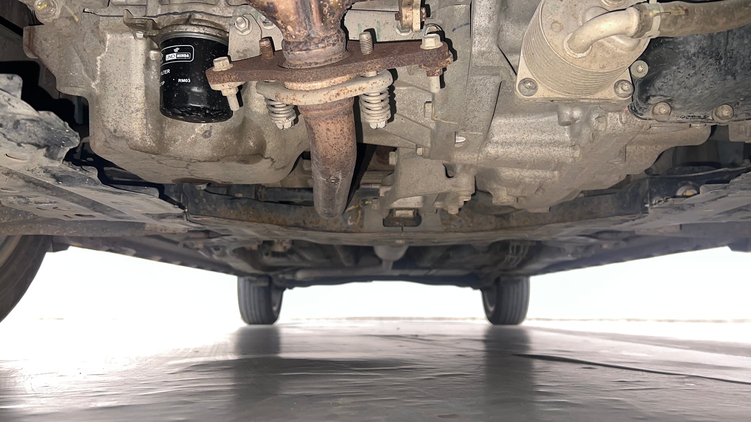 Used 2022 Maruti Suzuki XL6 Alpha Plus AT Petrol Petrol Automatic extra FRONT LEFT UNDERBODY VIEW