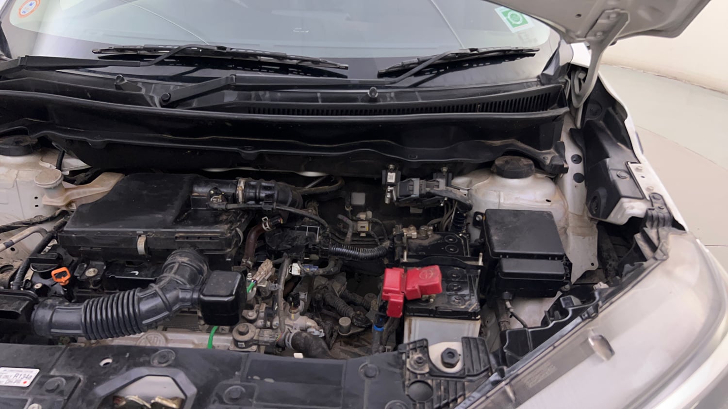Used 2023 Maruti Suzuki XL6 Alpha MT Petrol Petrol Manual engine ENGINE LEFT SIDE HINGE & APRON VIEW