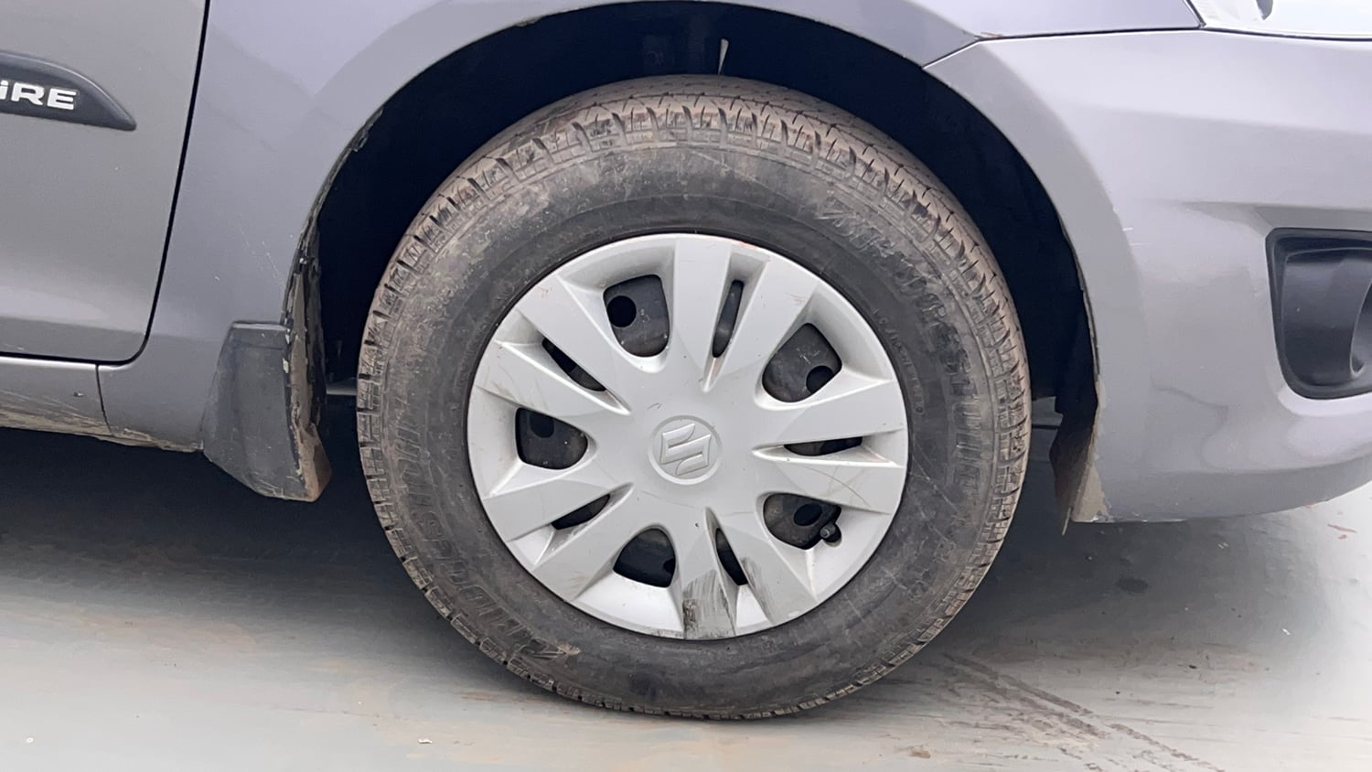 Used 2014 Maruti Suzuki Swift Dzire VXI Petrol Manual tyres RIGHT FRONT TYRE RIM VIEW