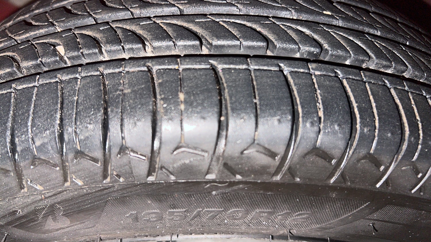 Used 2013 Tata Nano CX Petrol Manual tyres LEFT FRONT TYRE TREAD VIEW