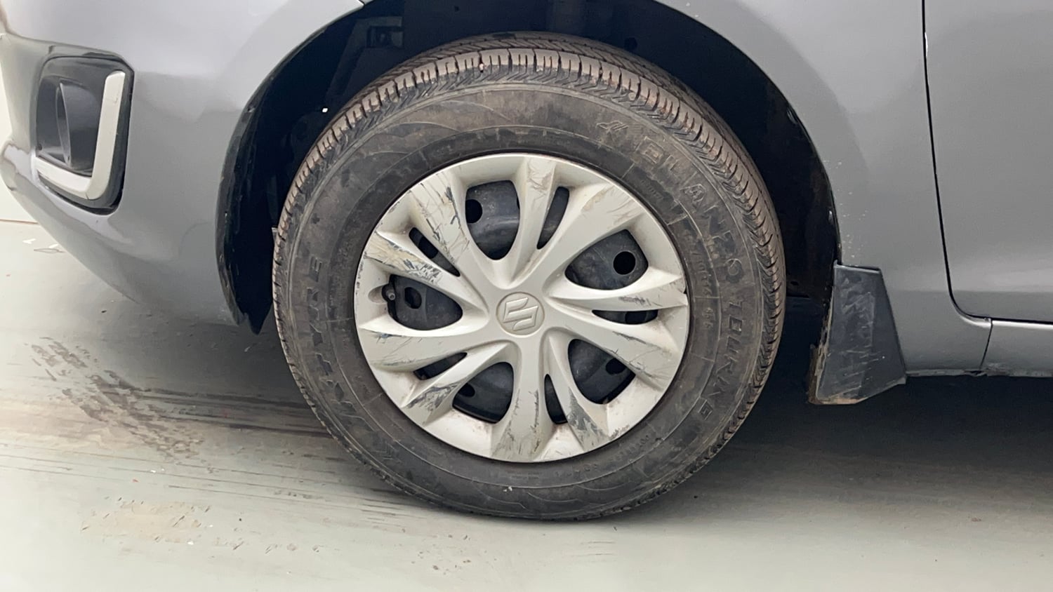 Used 2015 Maruti Suzuki Swift VXi Petrol Manual tyres LEFT FRONT TYRE RIM VIEW