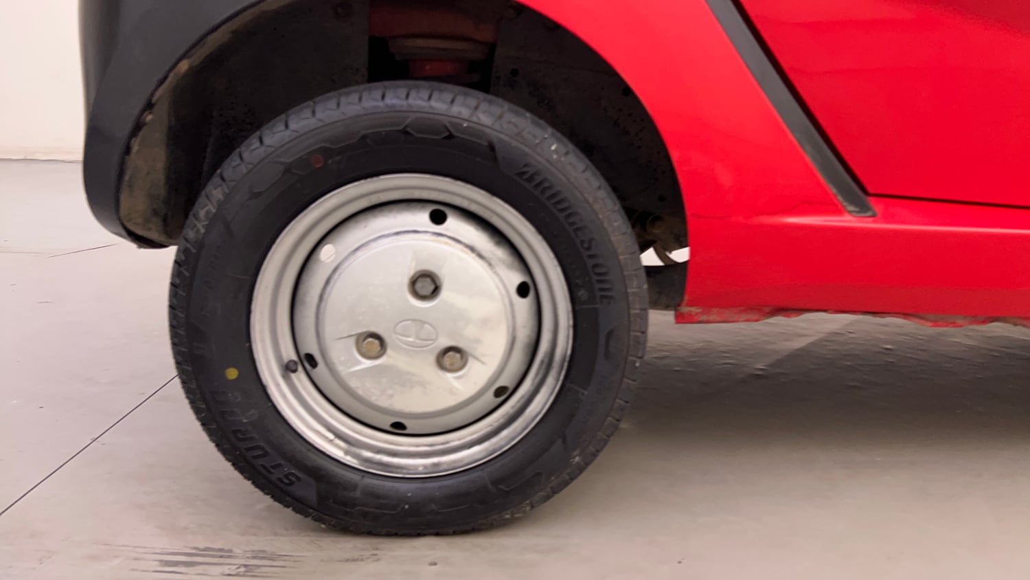 Used 2013 Tata Nano CX Petrol Manual tyres RIGHT REAR TYRE RIM VIEW