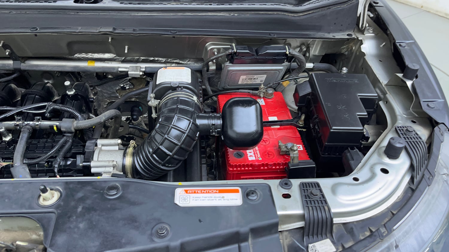 Used 2019 Mahindra KUV100 NXT K8 6 STR Dual Tone Petrol Manual engine ENGINE LEFT SIDE VIEW