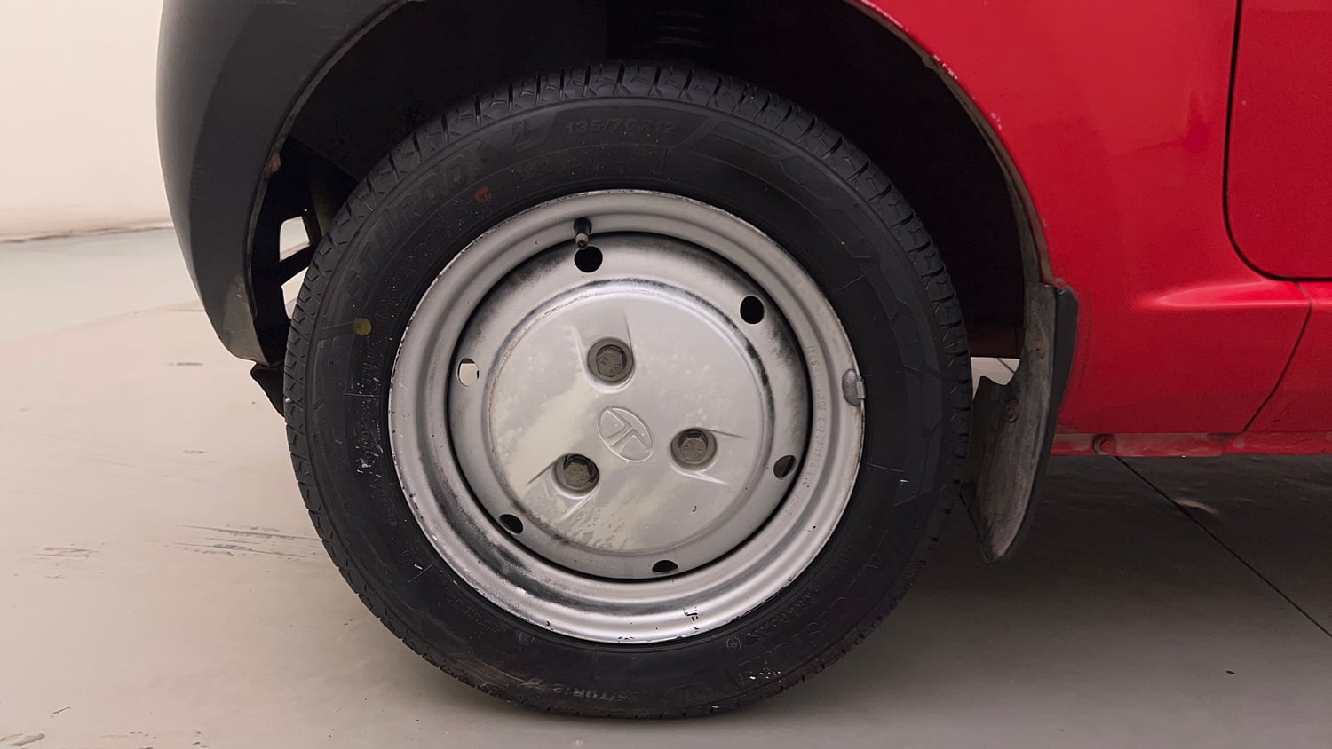 Used 2013 Tata Nano CX Petrol Manual tyres LEFT FRONT TYRE RIM VIEW