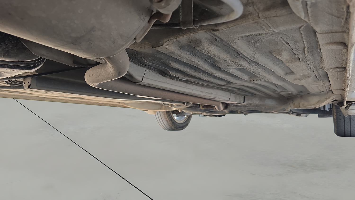 Used 2023 Honda Amaze VX 1.2 Petrol MT Petrol Manual extra REAR RIGHT UNDERBODY VIEW