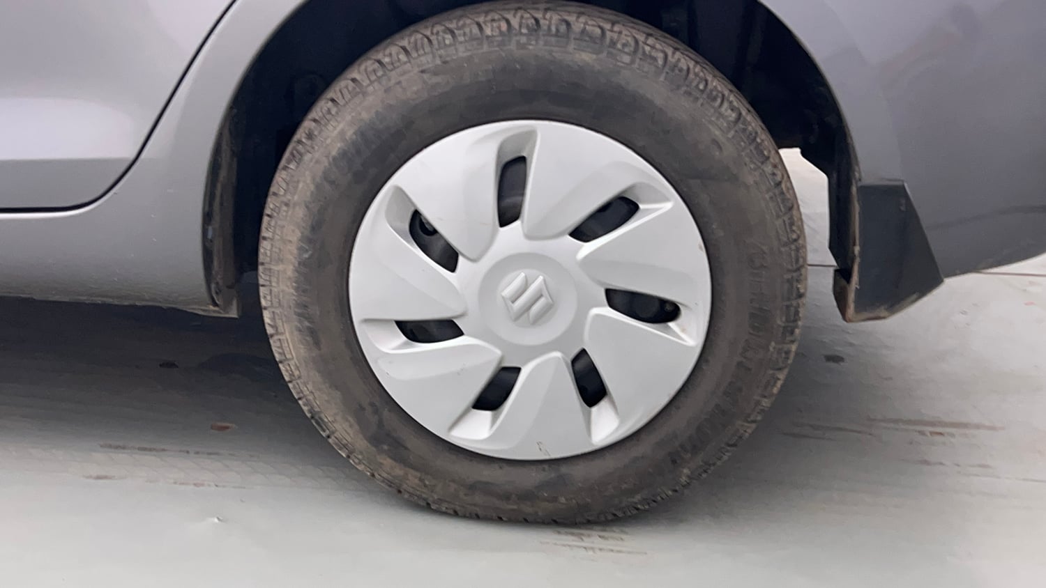 Used 2014 Maruti Suzuki Swift Dzire VXI Petrol Manual tyres LEFT REAR TYRE RIM VIEW