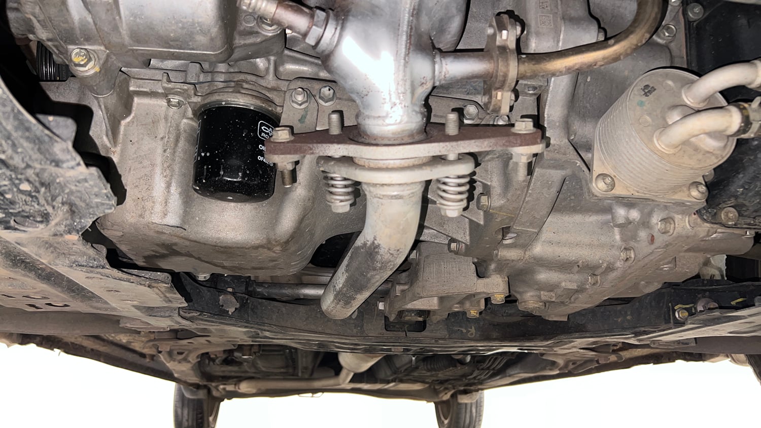Used 2023 Maruti Suzuki Ertiga ZXi AT Petrol Automatic extra FRONT LEFT UNDERBODY VIEW