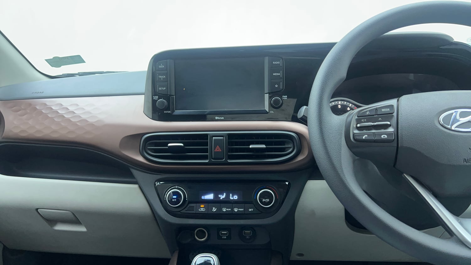 Used 2021 Hyundai Aura SX Plus 1.2 AMT Petrol Petrol Automatic top_features Integrated (in-dash) music system