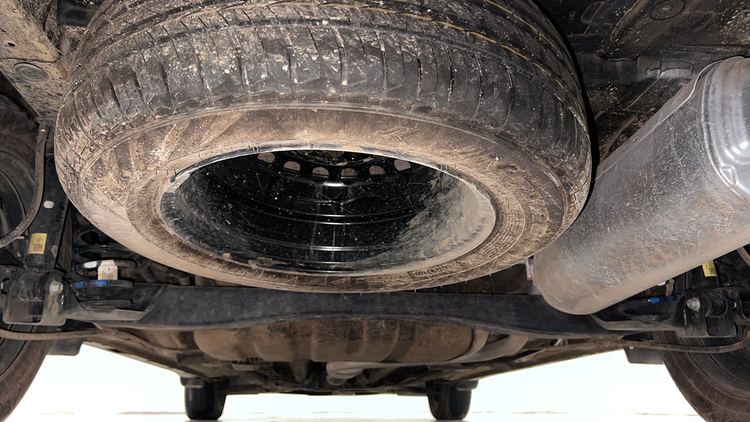 Used 2025 Kia Carens Premium (O) 1.5 Petrol 7 STR Petrol Manual extra REAR UNDERBODY VIEW (TAKEN FROM REAR)