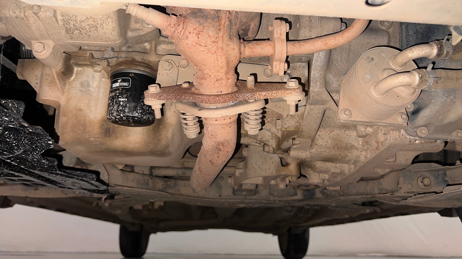 Used 2023 Maruti Suzuki XL6 Alpha Plus AT Petrol Dual Tone Petrol Automatic extra FRONT LEFT UNDERBODY VIEW