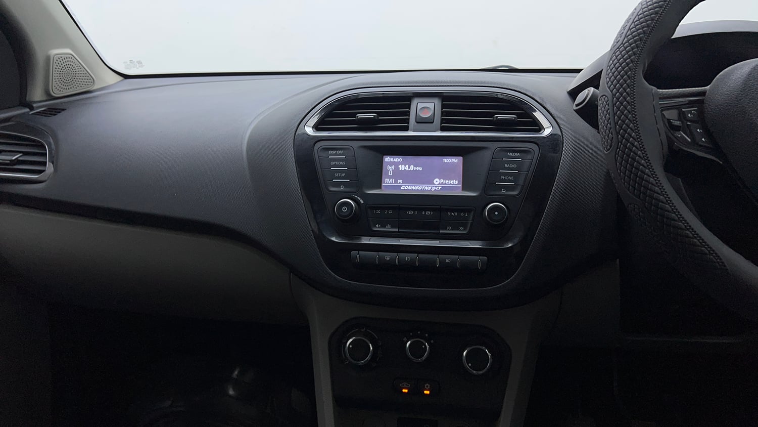 Used 2018 Tata Tiago Revotron XZ Petrol Manual top_features Integrated (in-dash) music system