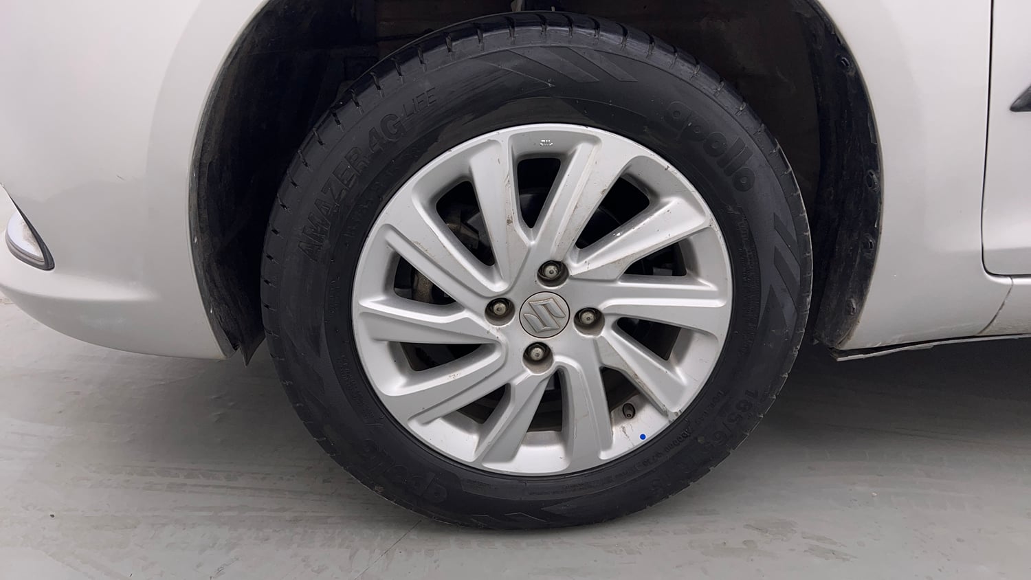 Used 2015 Maruti Suzuki Swift Dzire ZXI Petrol Manual tyres LEFT FRONT TYRE RIM VIEW