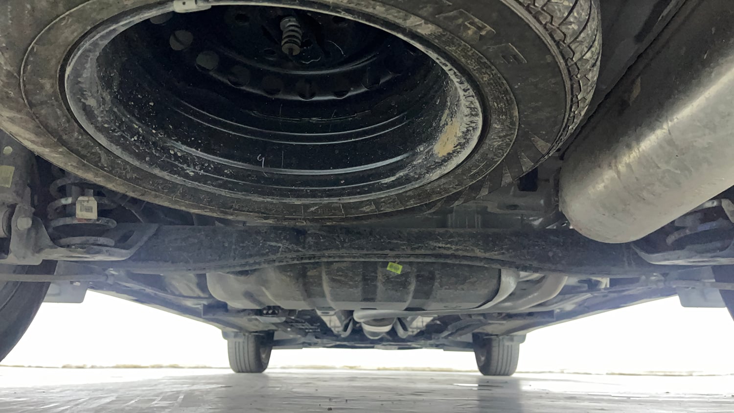 Used 2025 Kia Carens Clavis HTK 1.5 Petrol MT Petrol Manual extra REAR UNDERBODY VIEW (TAKEN FROM REAR)