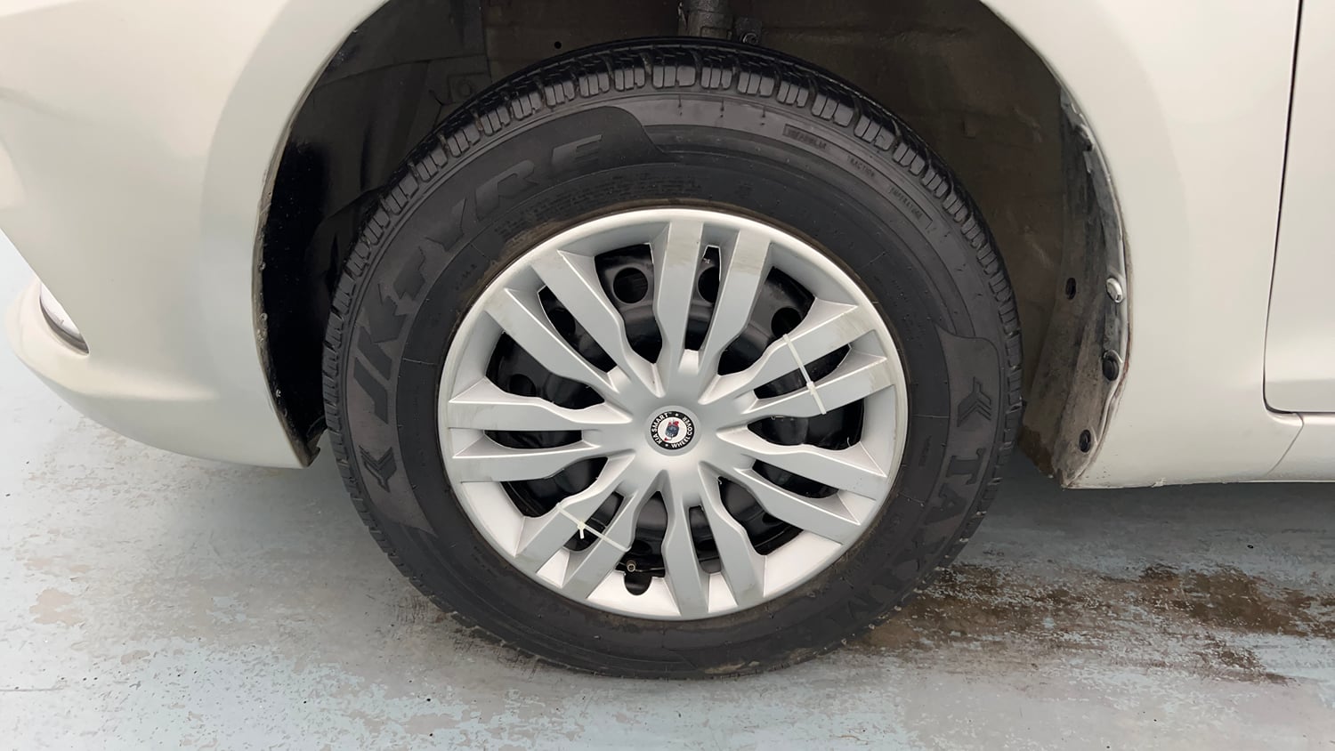 Used 2015 Maruti Suzuki Swift Dzire VXI Petrol Manual tyres LEFT FRONT TYRE RIM VIEW